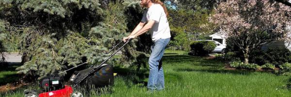 person mowing lawn